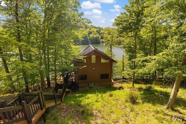 653 Natchez Ln, Sugar Grove, OH 43155 - view of side of home with log siding and a wooded view