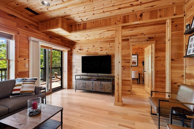 653 Natchez Ln, Sugar Grove, OH 43155 - living room with wooden walls, wood ceiling, healthy amount of natural light, and light wood-style flooring