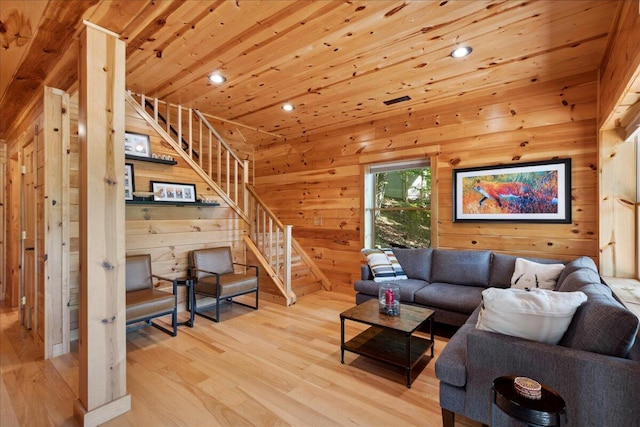 653 Natchez Ln, Sugar Grove, OH 43155 - living room with light wood finished floors, wood walls, stairway, recessed lighting, and wood ceiling