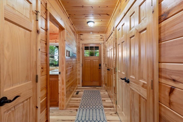 653 Natchez Ln, Sugar Grove, OH 43155 - entryway featuring light wood finished floors, wooden walls, and wooden ceiling