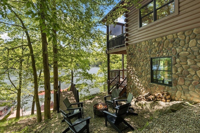 653 Natchez Ln, Sugar Grove, OH 43155 - view of yard with a balcony, an outdoor fire pit, and stairs