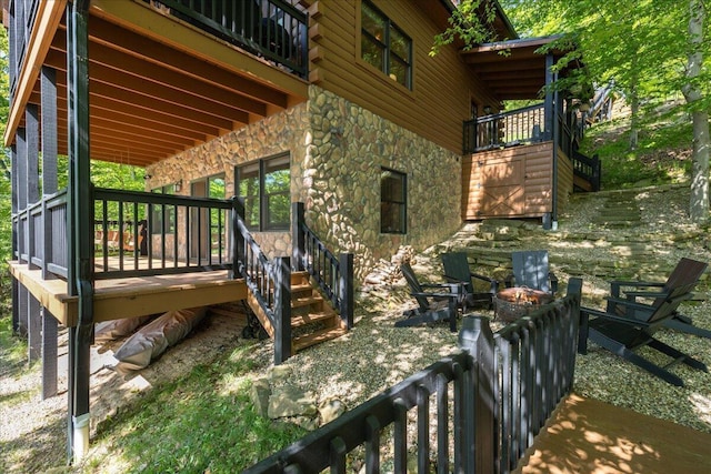 653 Natchez Ln, Sugar Grove, OH 43155 - view of patio / terrace featuring a fire pit and a wooden deck