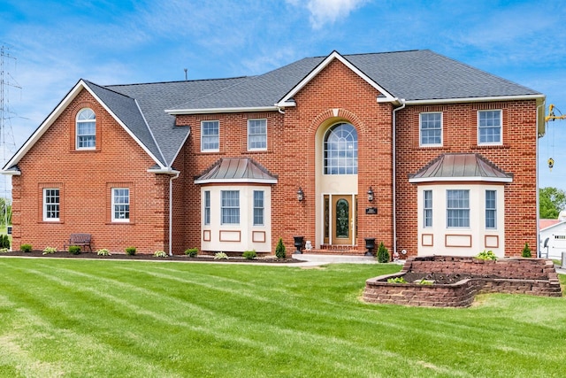 5360 Smothers Rd, Westerville, OH 43081 - view of front of property with brick siding, a front yard, and a standing seam roof