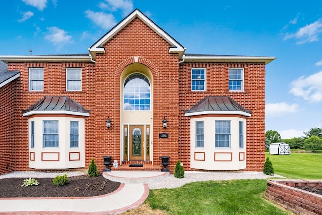 5360 Smothers Rd, Westerville, OH 43081 - view of front of house featuring a standing seam roof, brick siding, and a front yard