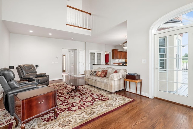 5360 Smothers Rd, Westerville, OH 43081 - living area with wood finished floors, healthy amount of natural light, baseboards, recessed lighting, and a towering ceiling