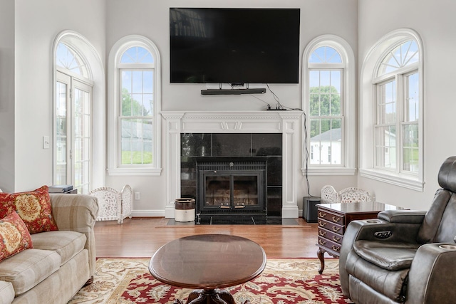 5360 Smothers Rd, Westerville, OH 43081 - living area featuring wood finished floors, a fireplace, and a high ceiling