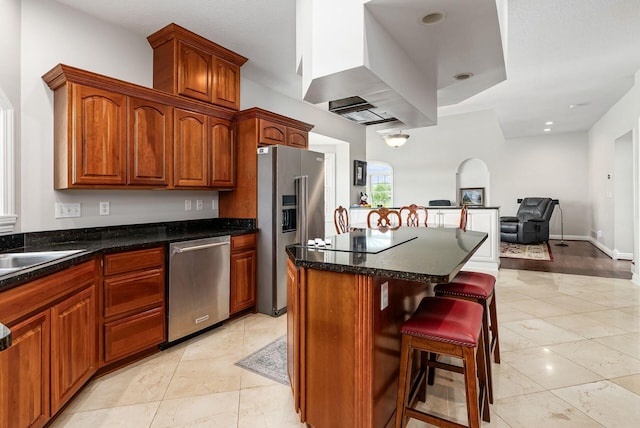 5360 Smothers Rd, Westerville, OH 43081 - kitchen with stainless steel appliances, a kitchen island, open floor plan, a kitchen breakfast bar, and island range hood