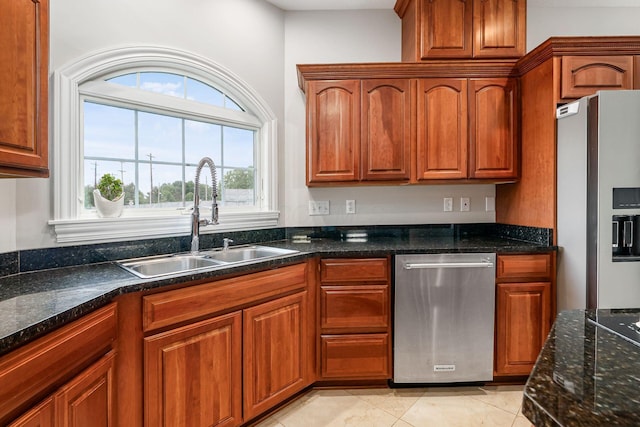 5360 Smothers Rd, Westerville, OH 43081 - kitchen with freestanding refrigerator, a sink, stainless steel dishwasher, and dark stone counters