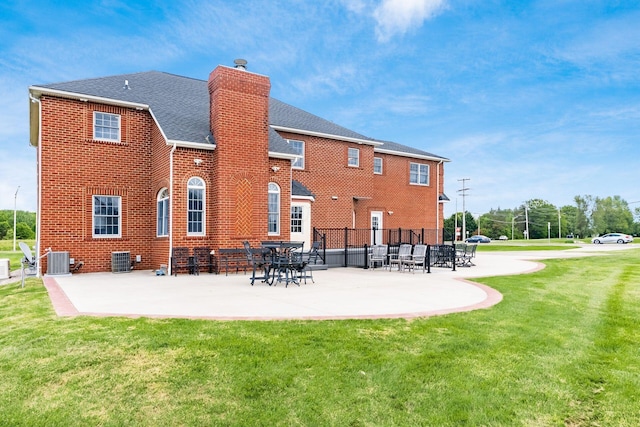 5360 Smothers Rd, Westerville, OH 43081 - back of property featuring a chimney, central air condition unit, brick siding, a shingled roof, and a patio area