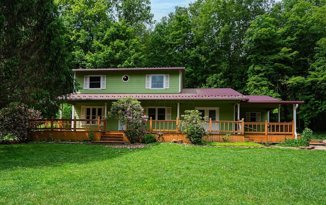 1959 Chapel Creek Rd, Chillicothe, OH 45601 - view of front facade featuring a front yard, metal roof, french doors, and a forest view