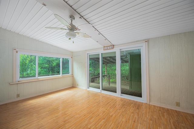 1959 Chapel Creek Rd, Chillicothe, OH 45601 - spare room featuring wood finished floors, lofted ceiling, wood walls, a ceiling fan, and wooden ceiling
