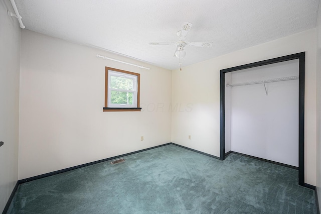 1959 Chapel Creek Rd, Chillicothe, OH 45601 - unfurnished bedroom featuring carpet floors, baseboards, a textured ceiling, a ceiling fan, and a closet