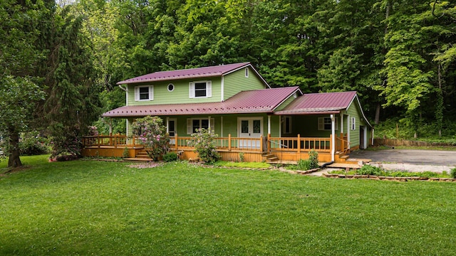 1959 Chapel Creek Rd, Chillicothe, OH 45601 - farmhouse featuring a porch, a front yard, and metal roof