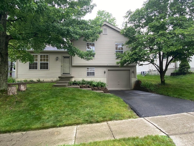 3523 Frenchpark Dr, Columbus, OH 43231 - split level home featuring driveway, a garage, and a front yard