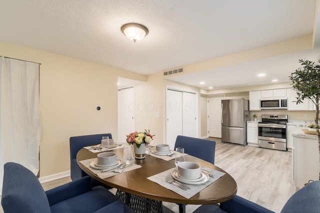 1419 Hentz Dr, Reynoldsburg, OH 43068 - dining area featuring light wood finished floors, recessed lighting, and baseboards
