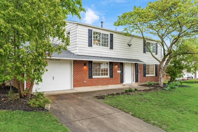 1419 Hentz Dr, Reynoldsburg, OH 43068 - traditional-style home with brick siding, a garage, driveway, a front yard, and roof with shingles