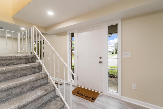 1419 Hentz Dr, Reynoldsburg, OH 43068 - entrance foyer featuring wood finished floors, stairs, healthy amount of natural light, recessed lighting, and baseboards