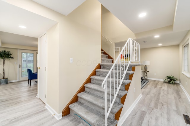 1419 Hentz Dr, Reynoldsburg, OH 43068 - stairway with wood finished floors, baseboards, and recessed lighting