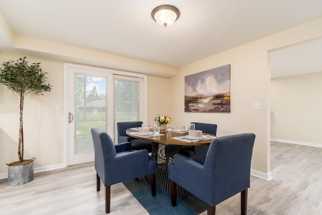 1419 Hentz Dr, Reynoldsburg, OH 43068 - dining area featuring light wood-style flooring and baseboards