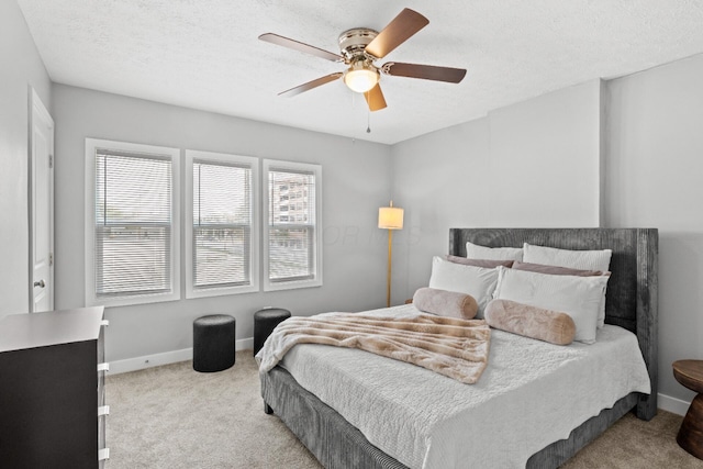 369 S 17th St, Columbus, OH 43205 - carpeted bedroom with baseboards, ceiling fan, and a textured ceiling