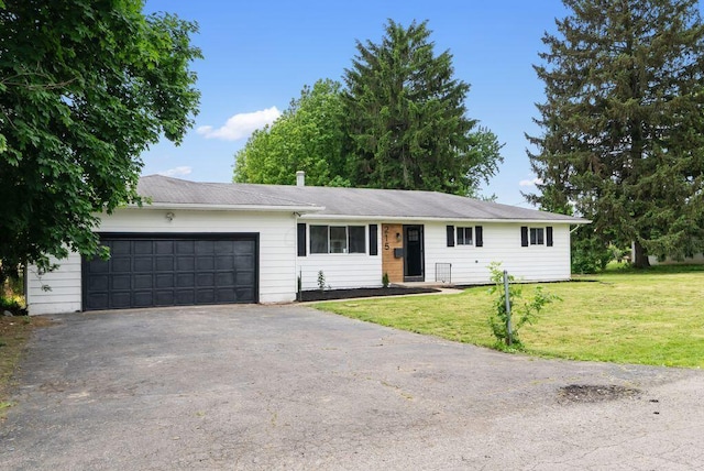 215 Stockbridge Rd, Columbus, OH 43207 - single story home featuring driveway, an attached garage, and a front yard