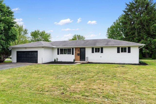 215 Stockbridge Rd, Columbus, OH 43207 - single story home featuring an attached garage, asphalt driveway, and a front yard
