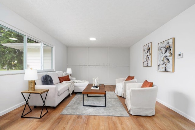 215 Stockbridge Rd, Columbus, OH 43207 - living area with wood finished floors, baseboards, and recessed lighting