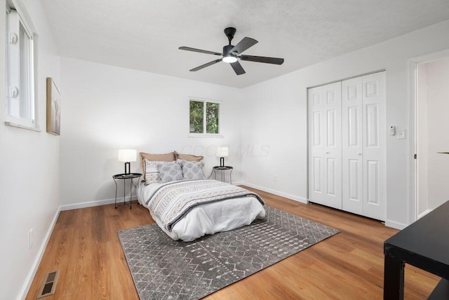 215 Stockbridge Rd, Columbus, OH 43207 - bedroom with wood finished floors, a closet, baseboards, and ceiling fan