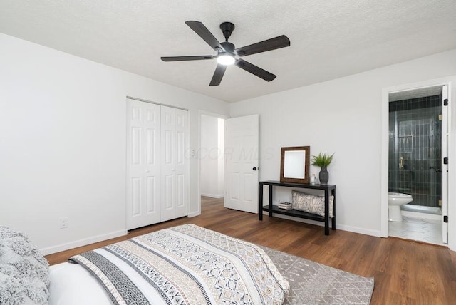 215 Stockbridge Rd, Columbus, OH 43207 - bedroom with wood finished floors, baseboards, a closet, and connected bathroom