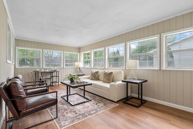 215 Stockbridge Rd, Columbus, OH 43207 - sunroom with wood finished floors, baseboards, a deck, and crown molding