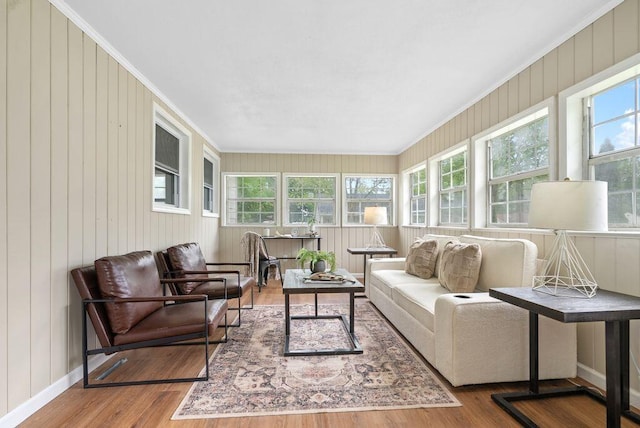 215 Stockbridge Rd, Columbus, OH 43207 - sunroom featuring wood finished floors, ornamental molding, baseboards, and wood walls