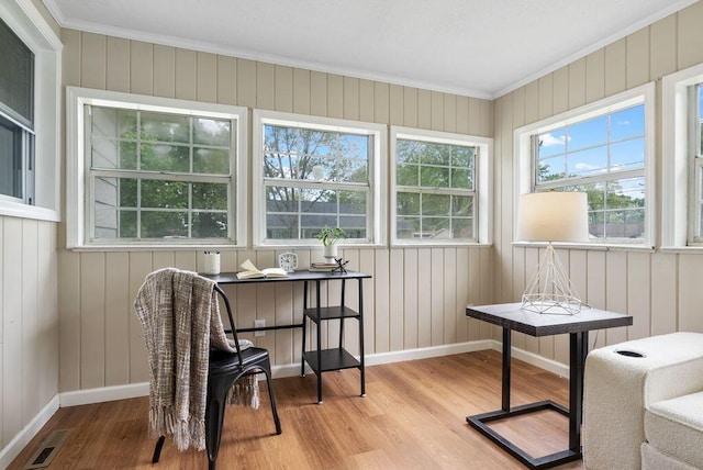 215 Stockbridge Rd, Columbus, OH 43207 - sitting room featuring wood finished floors, crown molding, baseboards, and wooden walls