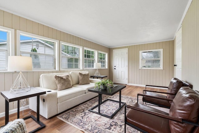 215 Stockbridge Rd, Columbus, OH 43207 - living room with wood finished floors, crown molding, and baseboards