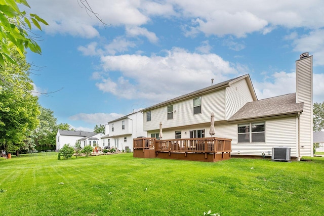 2643 Westrock Dr, Hilliard, OH 43026 - rear view of property featuring a lawn, a deck, and a chimney
