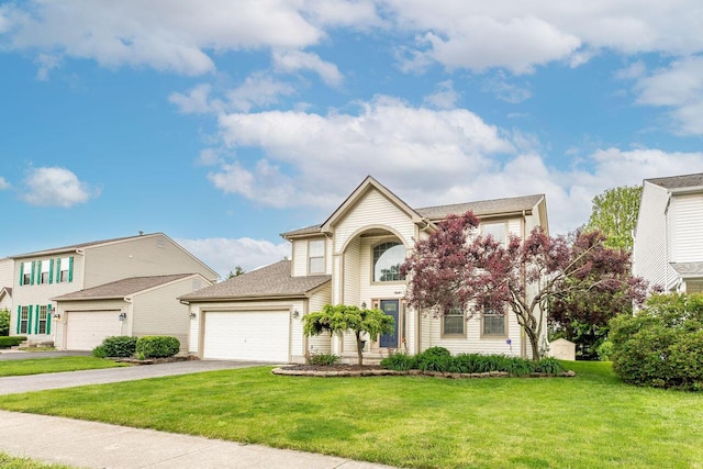 2643 Westrock Dr, Hilliard, OH 43026 - traditional-style house featuring driveway, an attached garage, and a front lawn