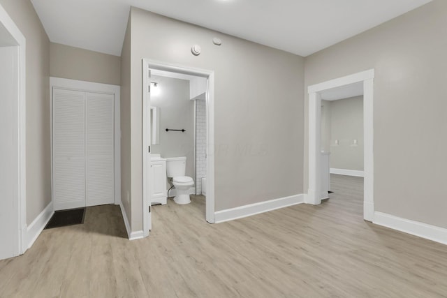 358 Saint Clair Ave, Columbus, OH 43203 - bathroom featuring toilet, wood finished floors, a closet, and baseboards