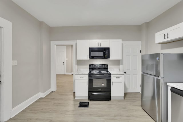 358 Saint Clair Ave, Columbus, OH 43203 - kitchen with black appliances, white cabinets, light wood finished floors, and baseboards