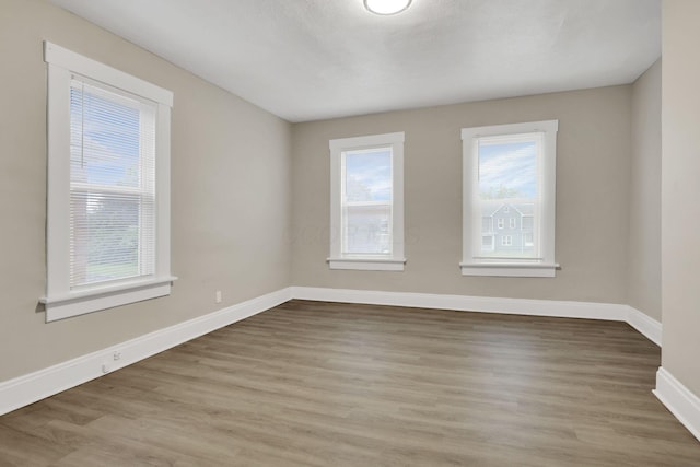 358 Saint Clair Ave, Columbus, OH 43203 - empty room featuring baseboards and wood finished floors