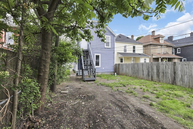 358 Saint Clair Ave, Columbus, OH 43203 - rear view of property featuring stairway and a fenced backyard