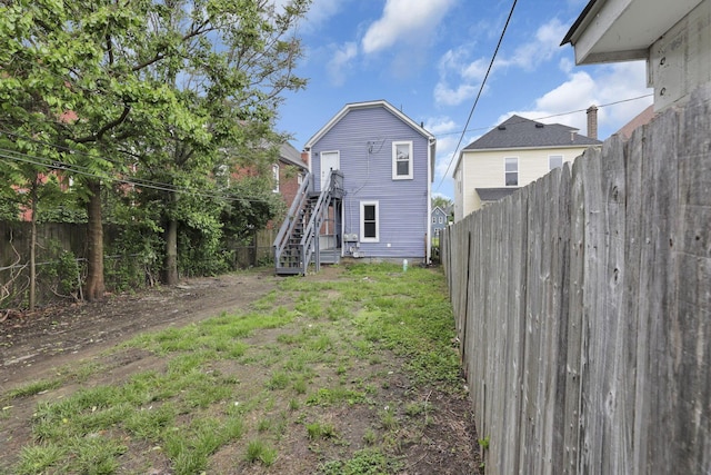 358 Saint Clair Ave, Columbus, OH 43203 - rear view of house with a fenced backyard and stairs