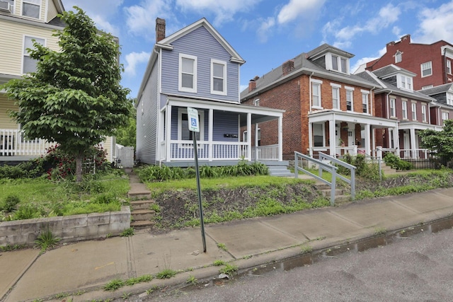 358 Saint Clair Ave, Columbus, OH 43203 - view of front of property featuring a porch and a chimney