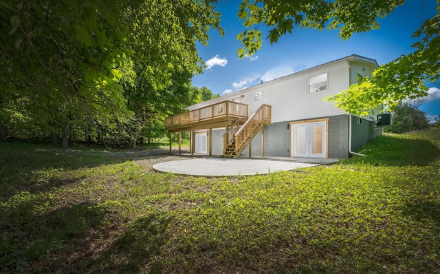 26 Crabtree Ct, Howard, OH 43028 - back of property with a patio area, a deck, stairway, and a lawn
