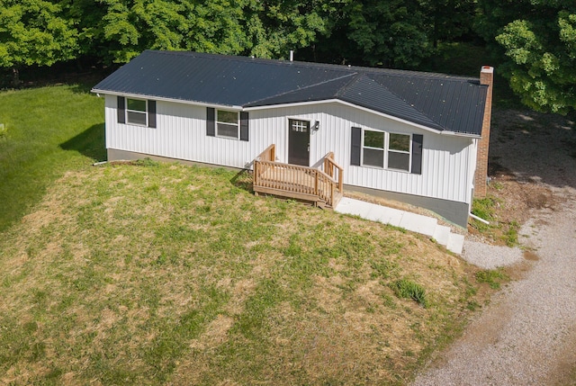 26 Crabtree Ct, Howard, OH 43028 - view of front of home with metal roof, a front lawn, and a chimney