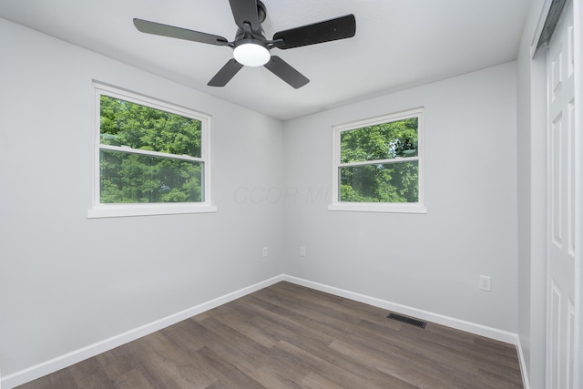 26 Crabtree Ct, Howard, OH 43028 - spare room featuring plenty of natural light, baseboards, and dark wood-style flooring