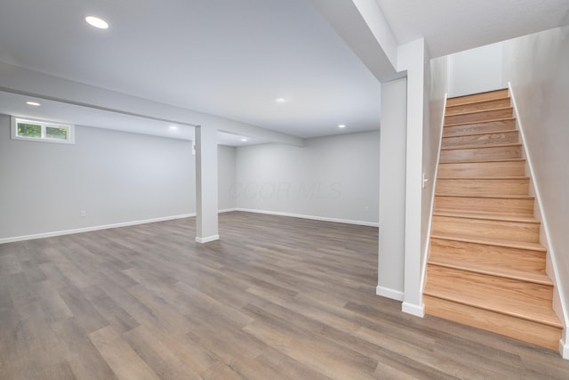 26 Crabtree Ct, Howard, OH 43028 - below grade area featuring stairway, wood finished floors, recessed lighting, and baseboards