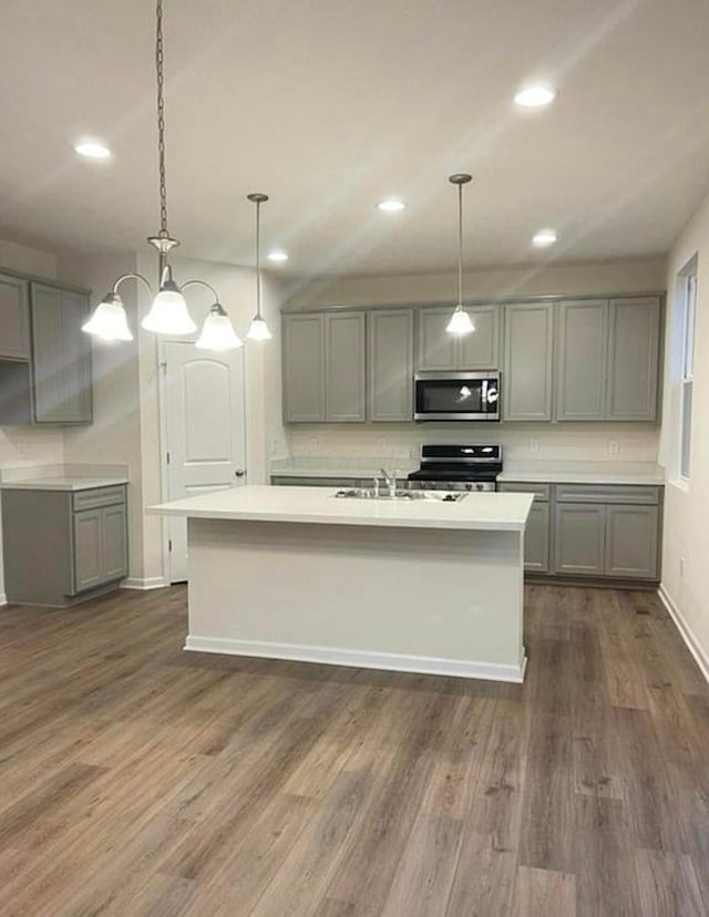 257 Whitetail Trl, Johnstown, OH 43031 - kitchen with appliances with stainless steel finishes, gray cabinetry, dark wood-style floors, and recessed lighting
