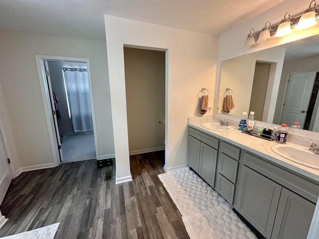 257 Whitetail Trl, Johnstown, OH 43031 - full bath with wood finished floors, double vanity, and baseboards