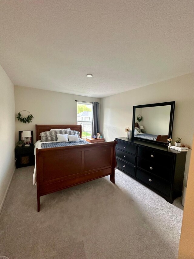 257 Whitetail Trl, Johnstown, OH 43031 - bedroom featuring light colored carpet and a textured ceiling