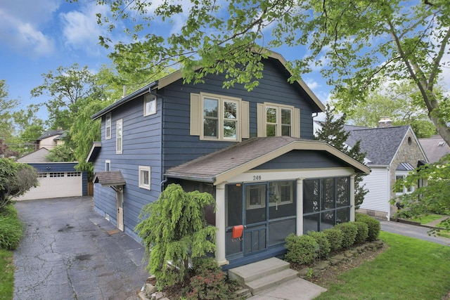 249 Blenheim Rd, Columbus, OH 43214 - view of front of property with a sunroom, an outbuilding, and a garage