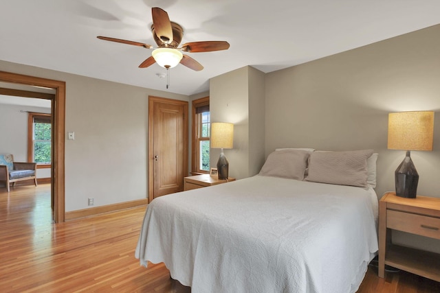 249 Blenheim Rd, Columbus, OH 43214 - bedroom with light wood-style floors, baseboards, a closet, and a ceiling fan